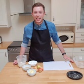 James Deveney cooking in a classroom kitchen