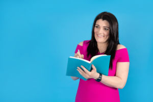 Photo of Tracy Heatley writing down her thoughts about the Mind Your Own Business Interview With Daniel Wilshire