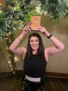 Latest news - Tracy Heatley holding and celebrating her Freshies Brilliant Broadcaster Award